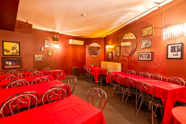 a view of a chairs and table in the city