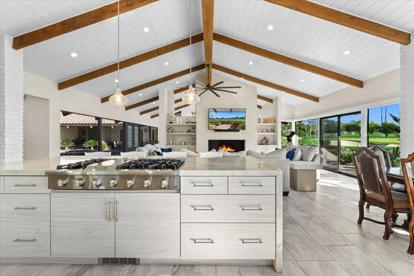 a kitchen with stainless steel appliances a refrigerator and a stove