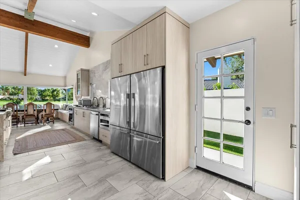 a view of a kitchen with a sink and cabinets