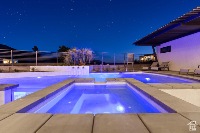 3558 South Cypress Road Hurricane, UT 84737 - Photo 42 of 57 Pool at night featuring a patio area