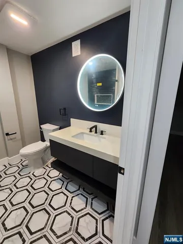 a bathroom with a toilet and a sink