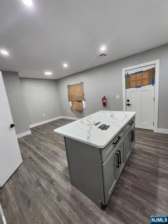 a utility room with wooden floor