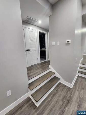 a view of wooden floor and entryway