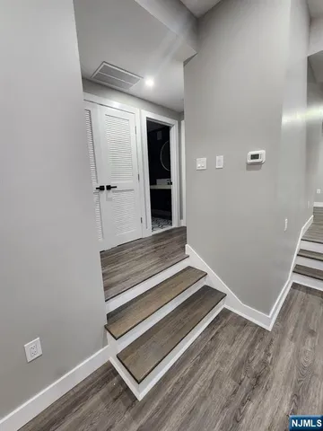 a view of wooden floor and entryway