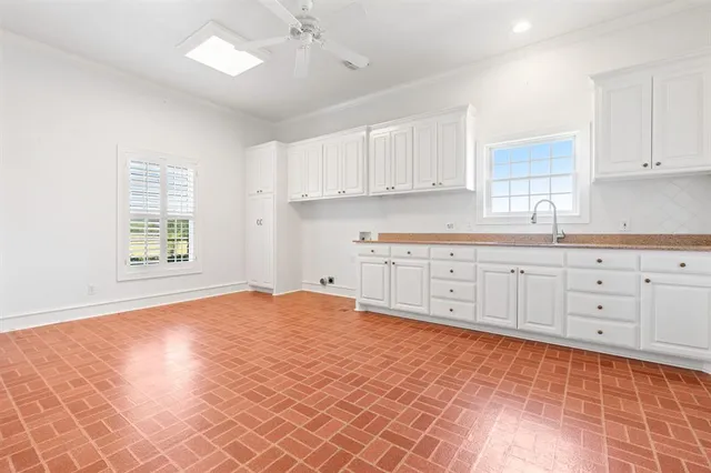 a view of a kitchen with electric appliances