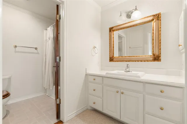a bathroom with a double vanity sink and mirror