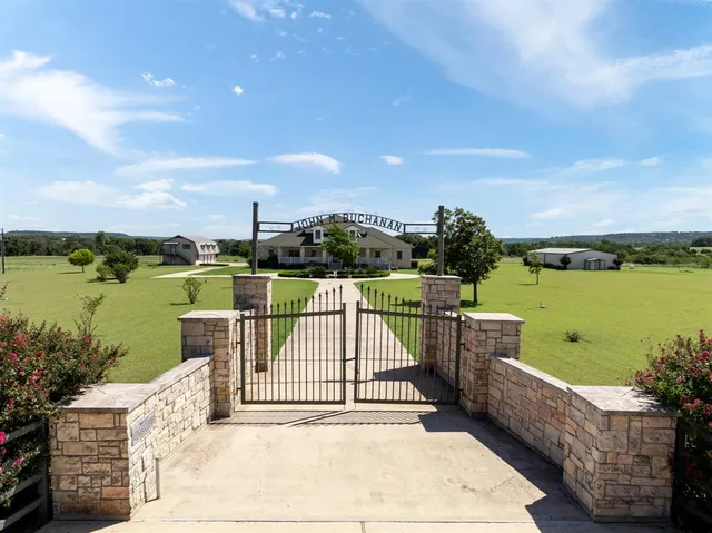 a view of a lake with a floor to ceiling window stairs and city view