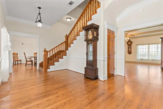 a view of an entryway with wooden floor