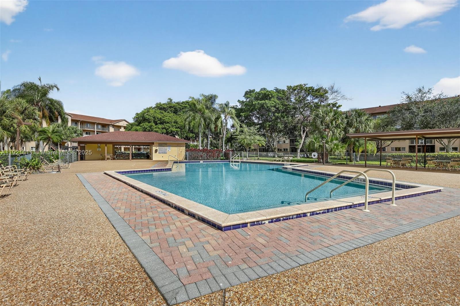 13705 Southwest 12th Street, Unit 103B Pembroke Pines, FL 33027 - Photo 50 of 59 a view of a swimming pool