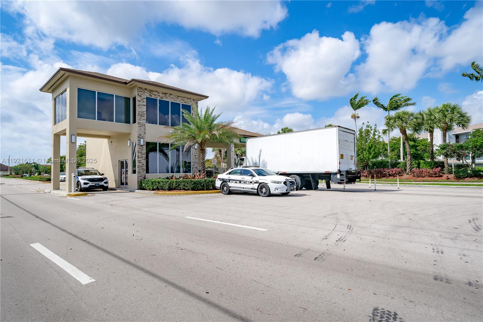 13705 Southwest 12th Street, Unit 103B Pembroke Pines, FL 33027 - Photo 56 of 59 a view of a street with a building in the background