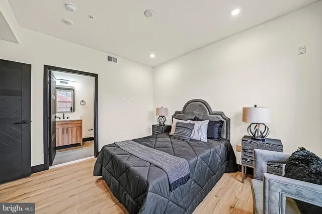 a bedroom with a bed and a dresser