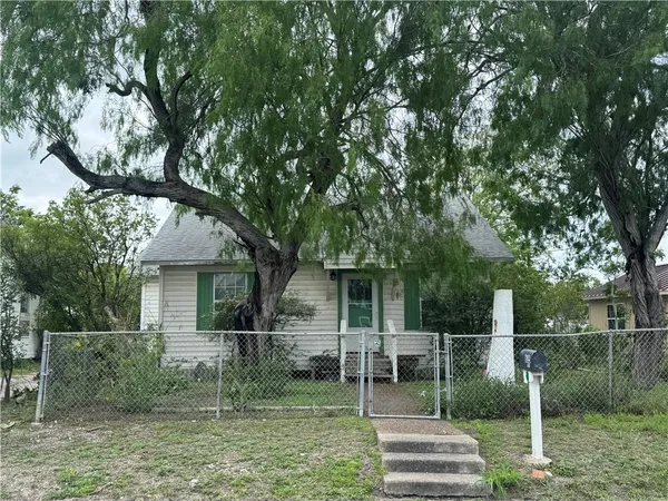 a view of house with a backyard