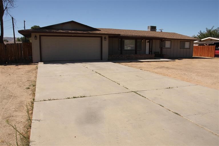 20987 Cayuga Road Apple Valley, CA 92308 - Photo 1 of 1 a front view of a house