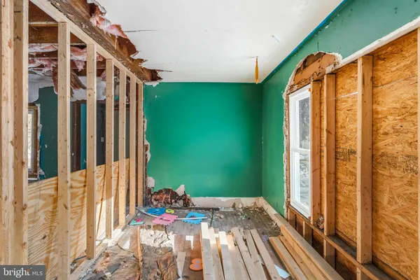 front view of a house with a large window