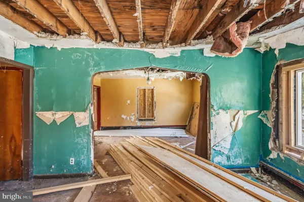 a view of a room with wooden walls and stairs