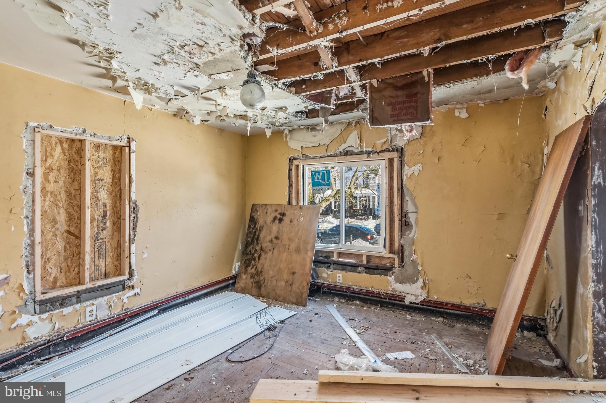 115 8th Street Salem, NJ 08079 - Photo 8 of 20 a view of a room with wooden walls and stairs