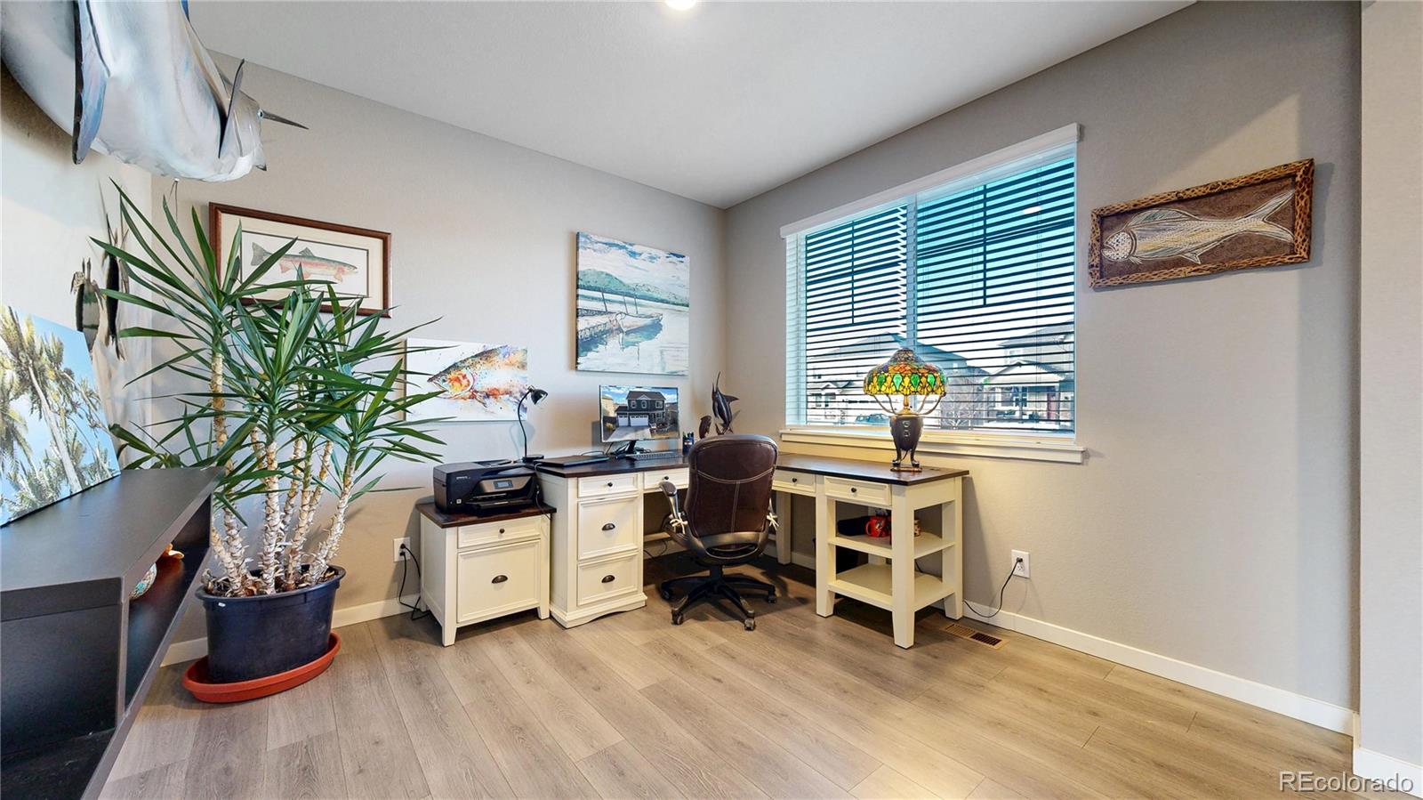 1562 Sun River Road Berthoud, CO 80513 - Photo 12 of 46 a view of a workspace with furniture and a window