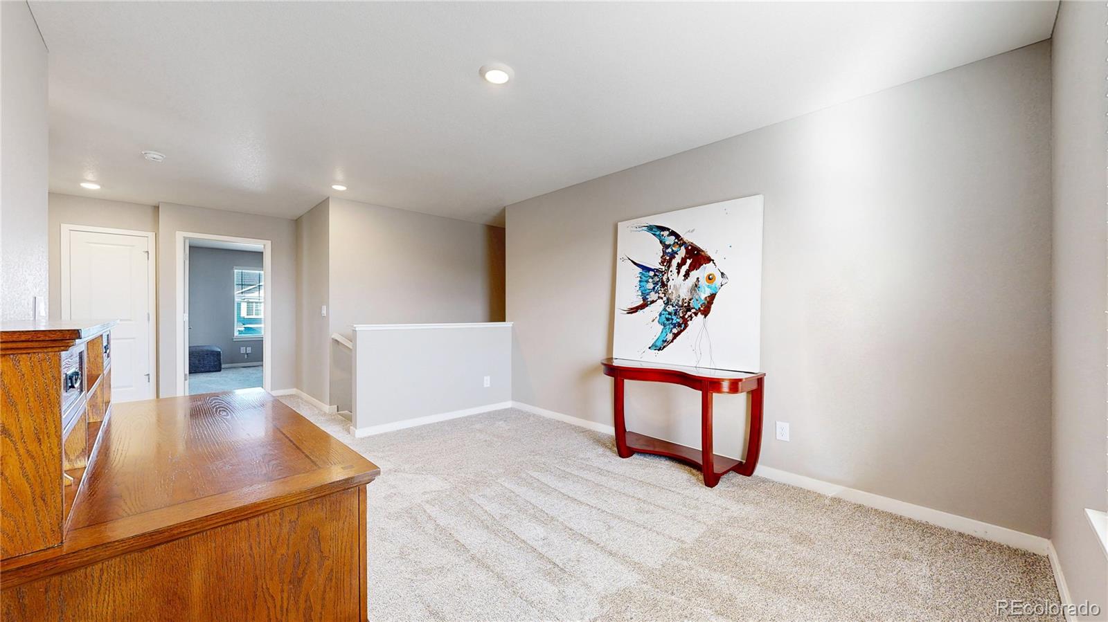 1562 Sun River Road Berthoud, CO 80513 - Photo 17 of 46 a view of a hallway with furniture