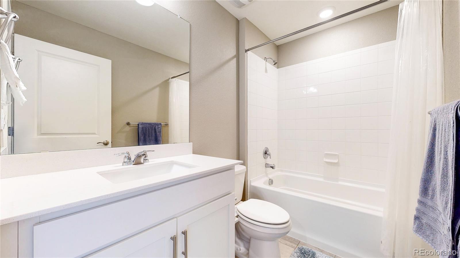 1562 Sun River Road Berthoud, CO 80513 - Photo 26 of 46 a bathroom with a sink toilet and shower