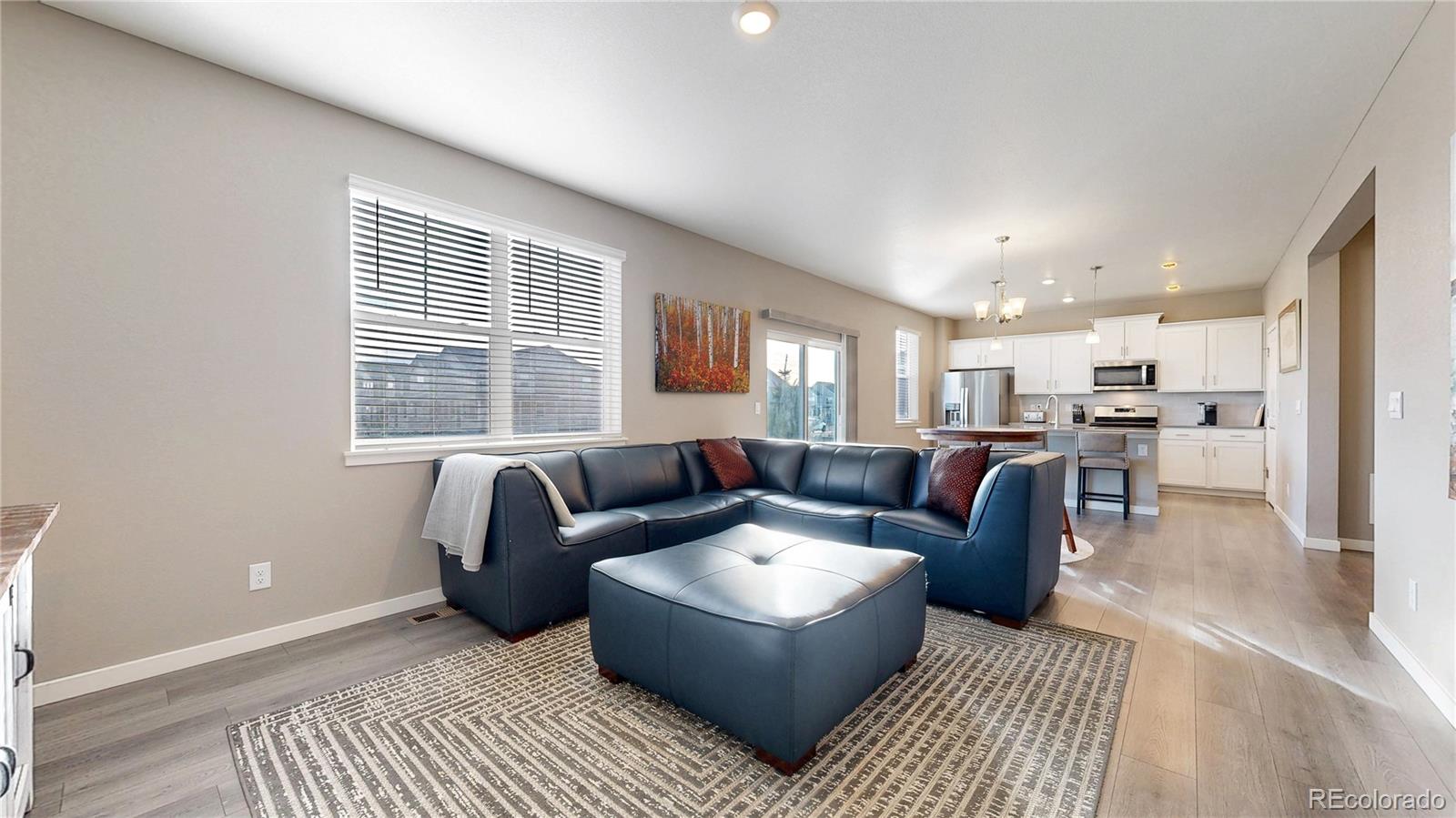 1562 Sun River Road Berthoud, CO 80513 - Photo 4 of 46 a living room with furniture and a large window