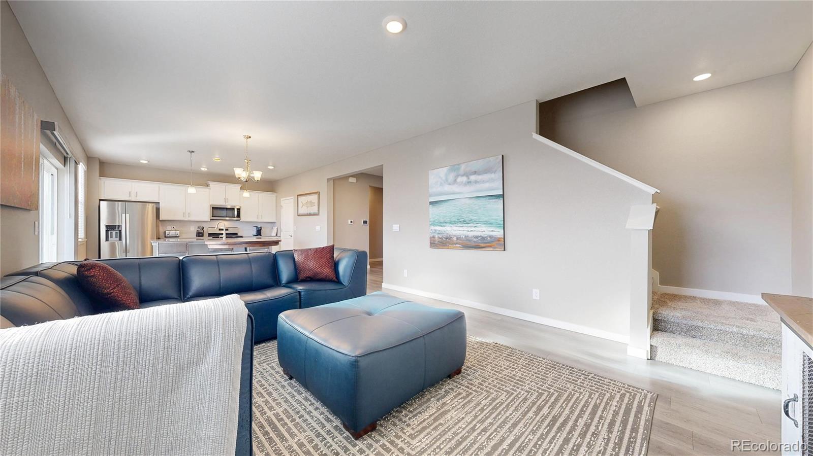 1562 Sun River Road Berthoud, CO 80513 - Photo 5 of 46 a living room with furniture and a couch