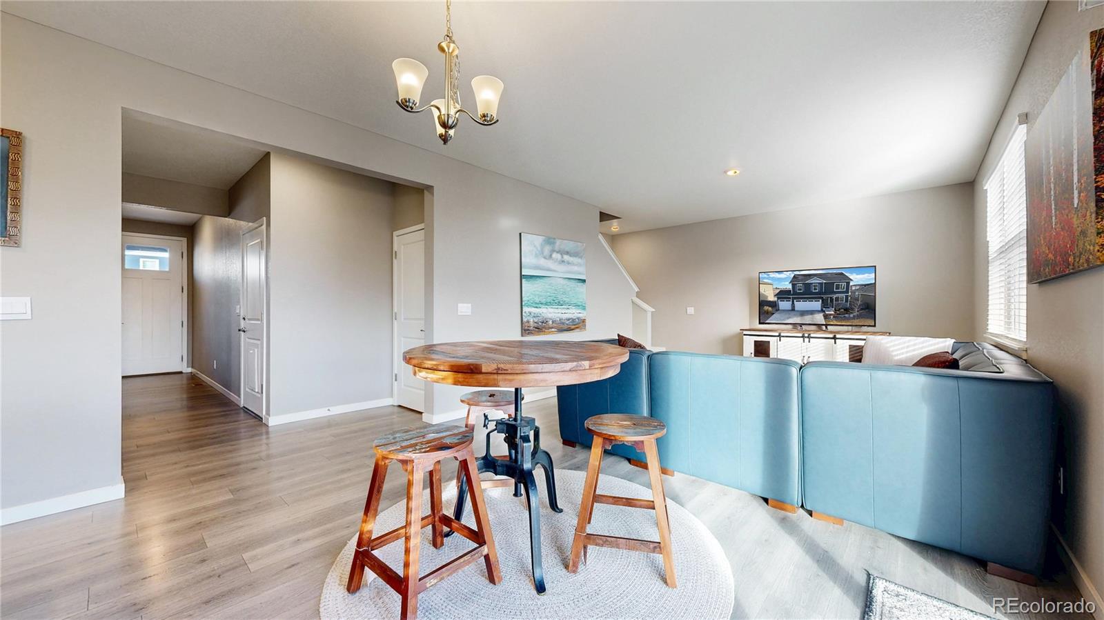 1562 Sun River Road Berthoud, CO 80513 - Photo 8 of 46 a kitchen with stainless steel appliances kitchen island a table and chairs in it