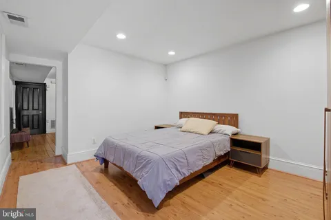 a bedroom with a bed and a view of bathroom