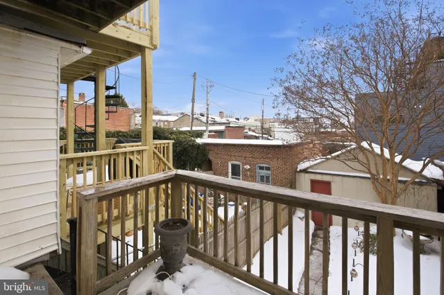 a view of a balcony with chairs