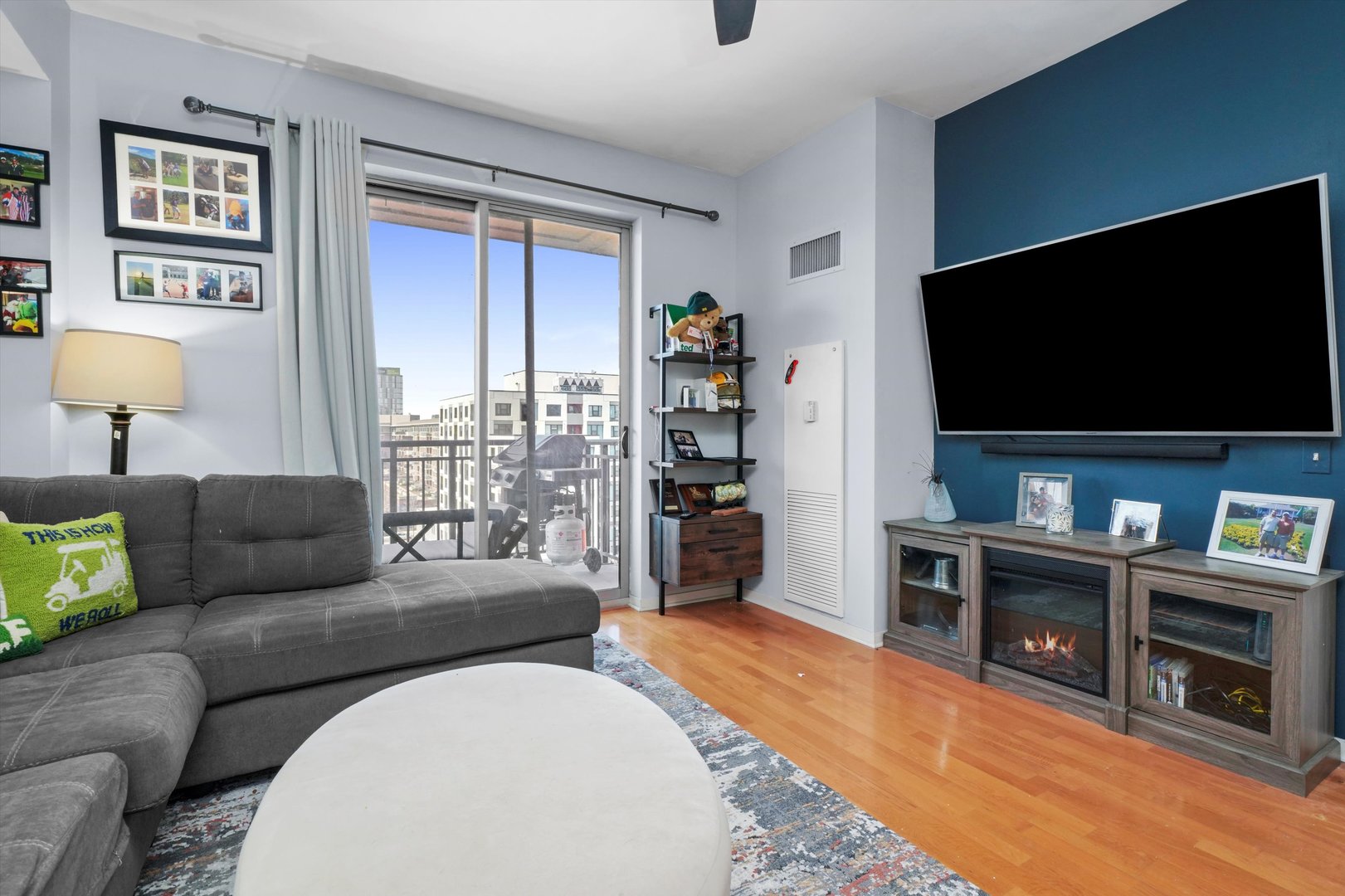 437 West Division Street, Unit 812 Chicago, IL 60610 - Photo 3 of 11 a living room with furniture and a flat screen tv
