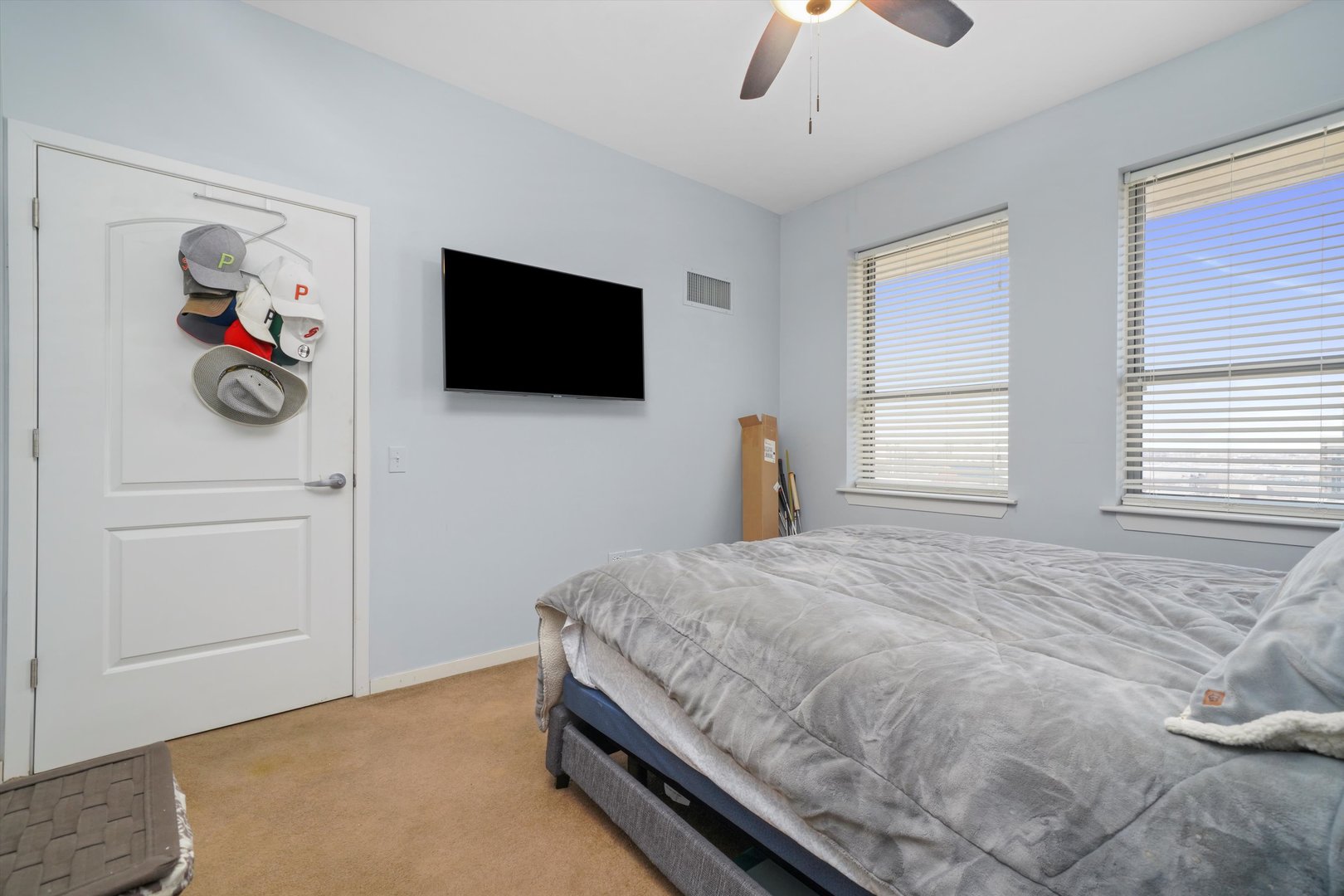 437 West Division Street, Unit 812 Chicago, IL 60610 - Photo 5 of 11 a bedroom with a bed and a flat screen tv