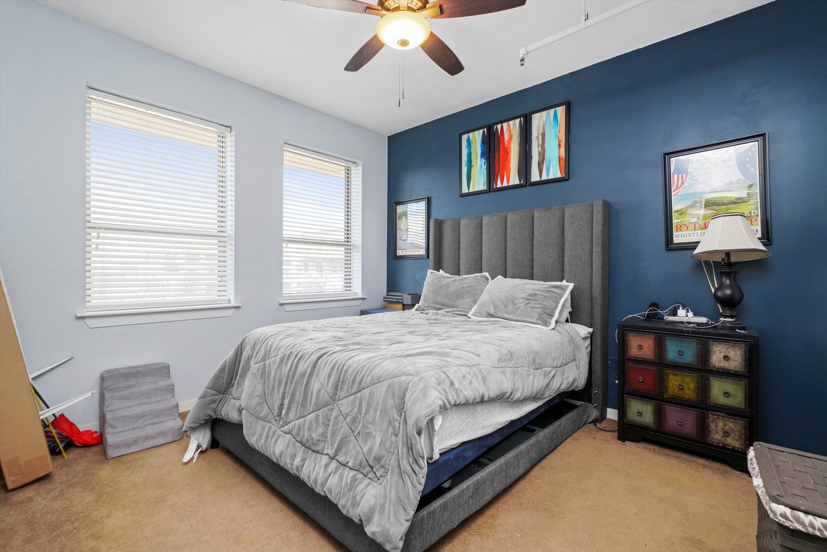 437 West Division Street, Unit 812 Chicago, IL 60610 - Photo 6 of 11 a bedroom with a bed and a chandelier