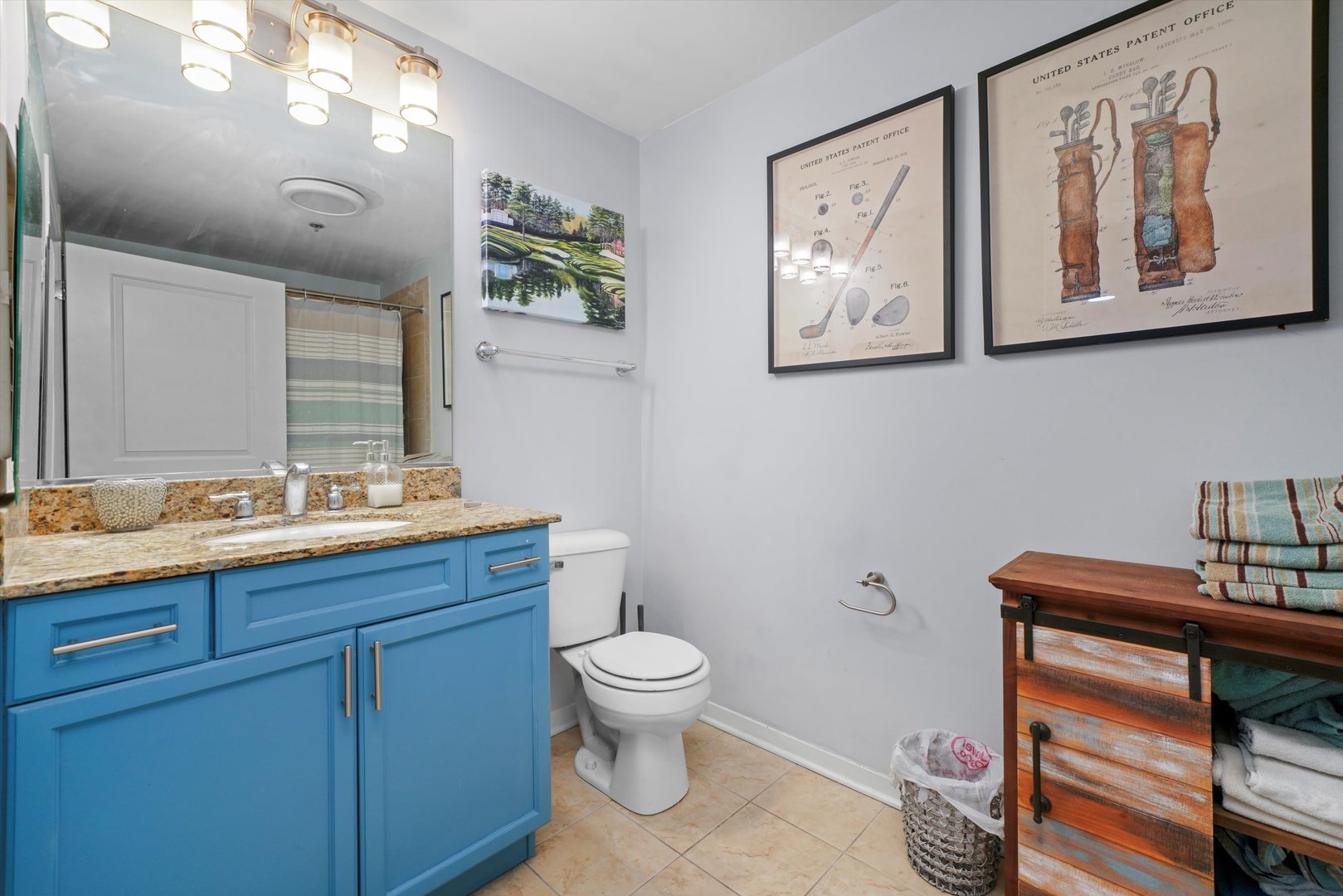 437 West Division Street, Unit 812 Chicago, IL 60610 - Photo 7 of 11 a bathroom with a toilet a sink and mirror