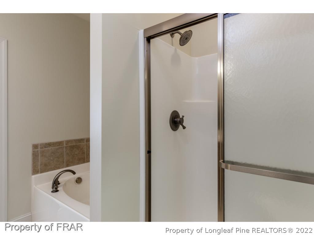 18 Elk Ridge Lane Southern Pines, NC 28387 - Photo 16 of 21 a bathroom with a shower and a bath tub