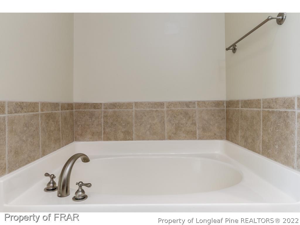 18 Elk Ridge Lane Southern Pines, NC 28387 - Photo 17 of 21 a bathroom with a bathtub