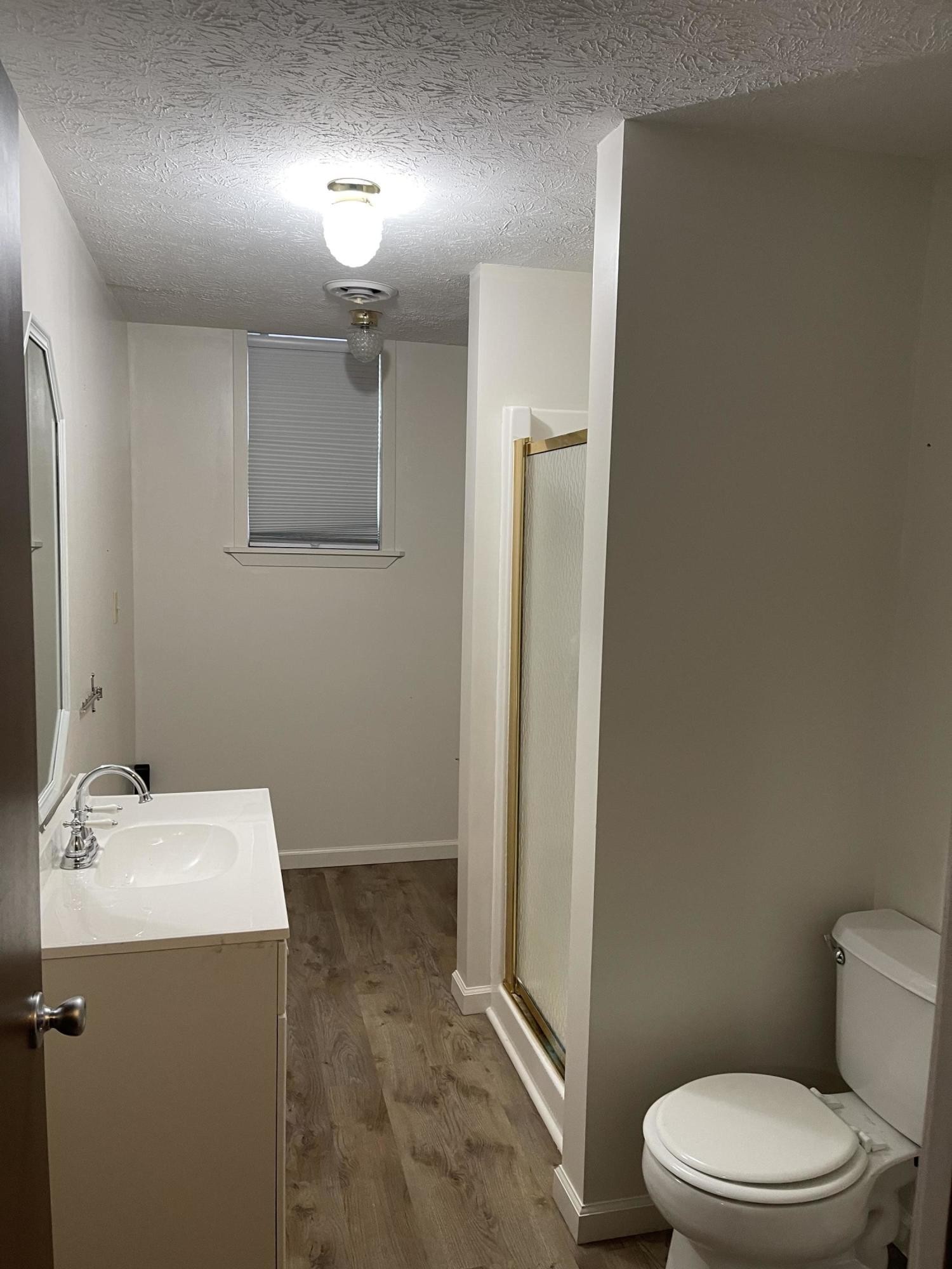 1616 Golf Course Road Newport, TN 37821 - Photo 19 of 38 a bathroom with a toilet a sink and mirror