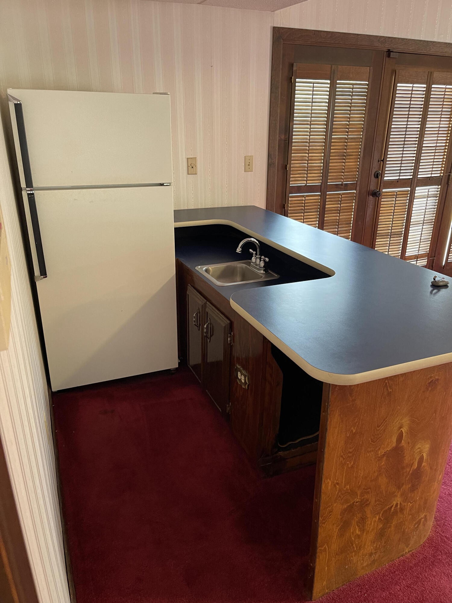 1616 Golf Course Road Newport, TN 37821 - Photo 6 of 38 a kitchen with a sink and a refrigerator