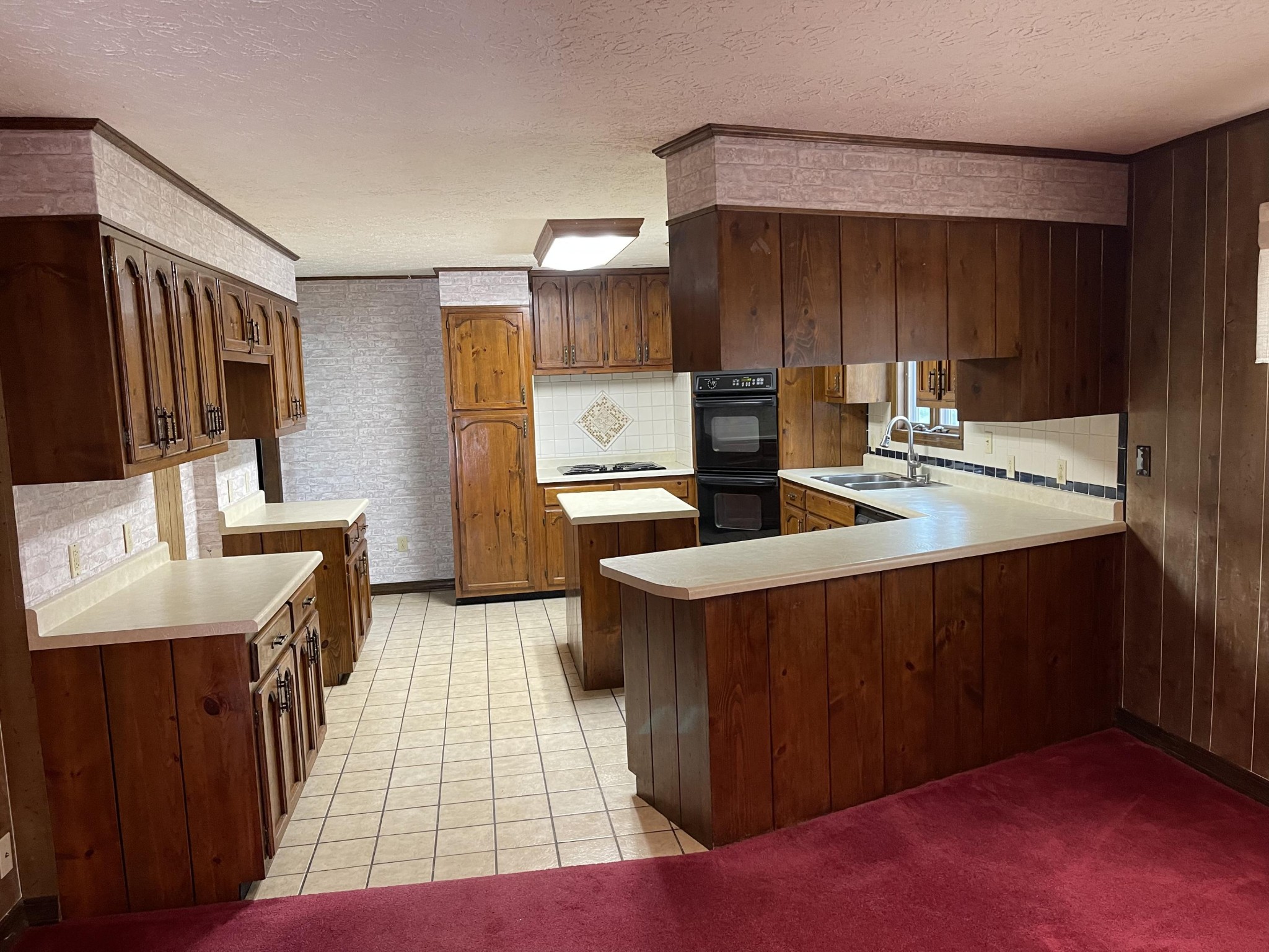1616 Golf Course Road Newport, TN 37821 - Photo 9 of 38 a kitchen with sink cabinets and refrigerator