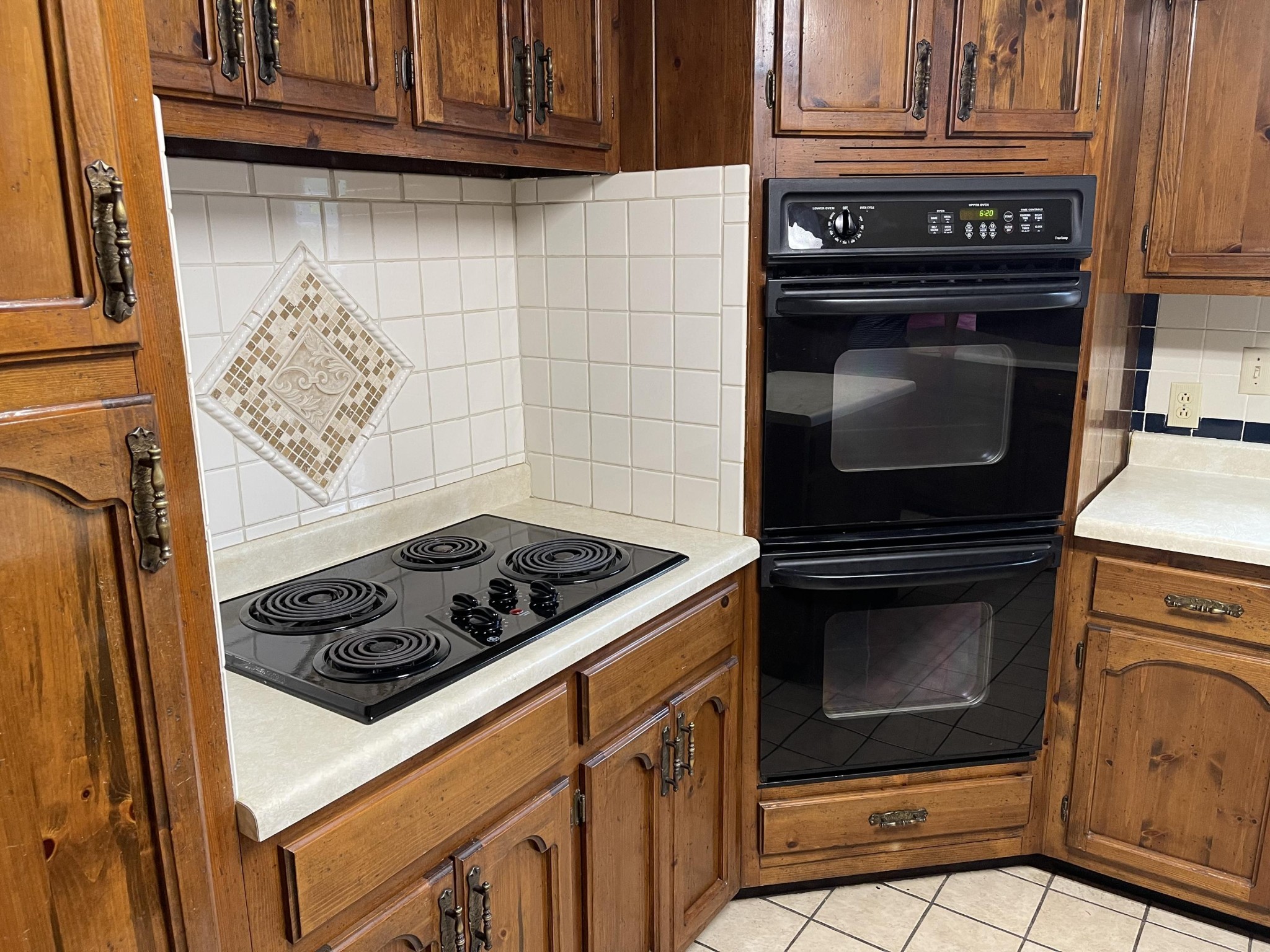 1616 Golf Course Road Newport, TN 37821 - Photo 10 of 38 a kitchen with granite countertop cabinets and steel stove top oven
