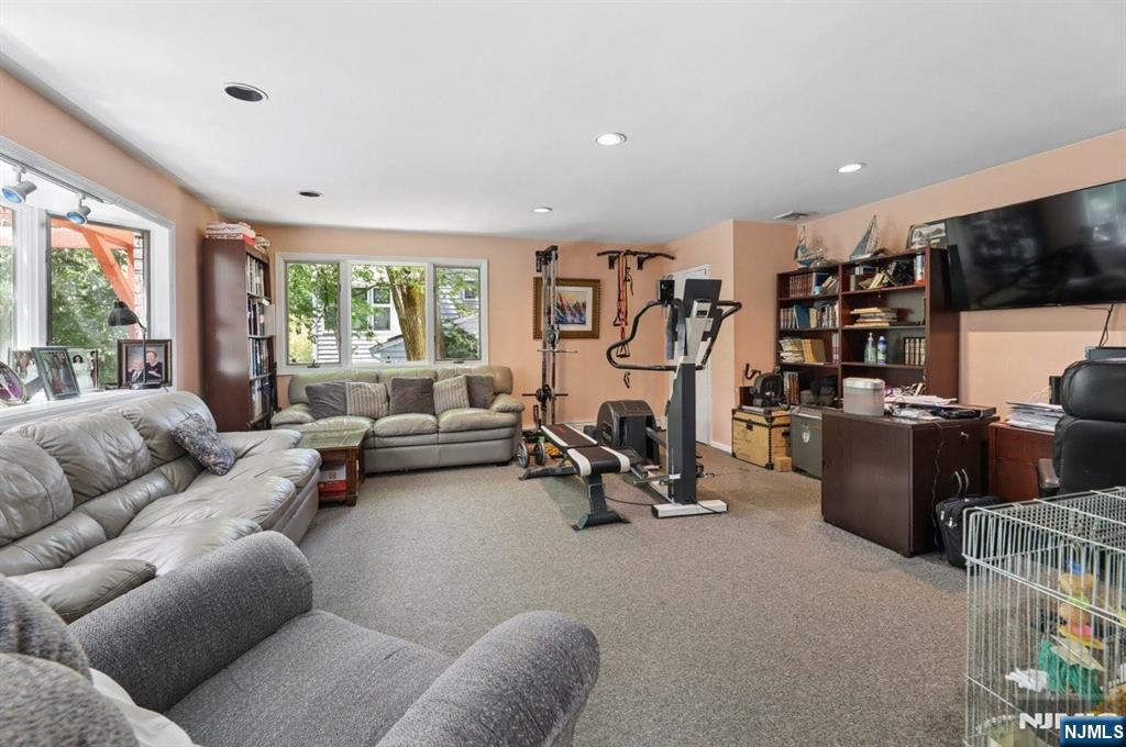 604 Rutland Avenue Teaneck, NJ 07666 - Photo 11 of 31 a living room with furniture and a flat screen tv