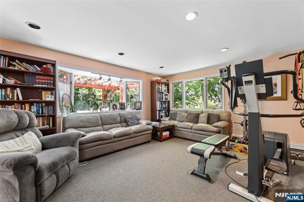 604 Rutland Avenue Teaneck, NJ 07666 - Photo 12 of 31 a living room with furniture or window and a flat screen tv
