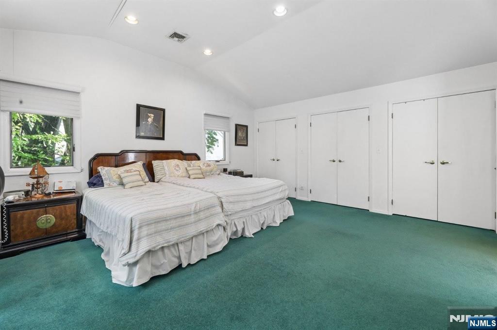 604 Rutland Avenue Teaneck, NJ 07666 - Photo 15 of 31 a bedroom with a bed and a potted plant
