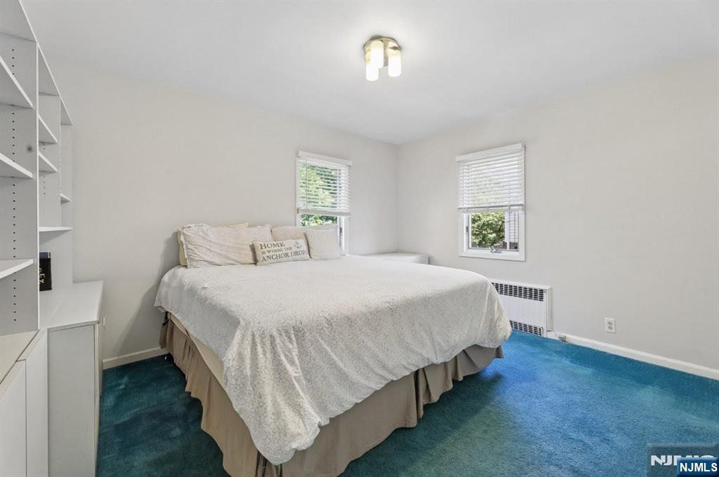 604 Rutland Avenue Teaneck, NJ 07666 - Photo 18 of 31 a bedroom with a bed and a window