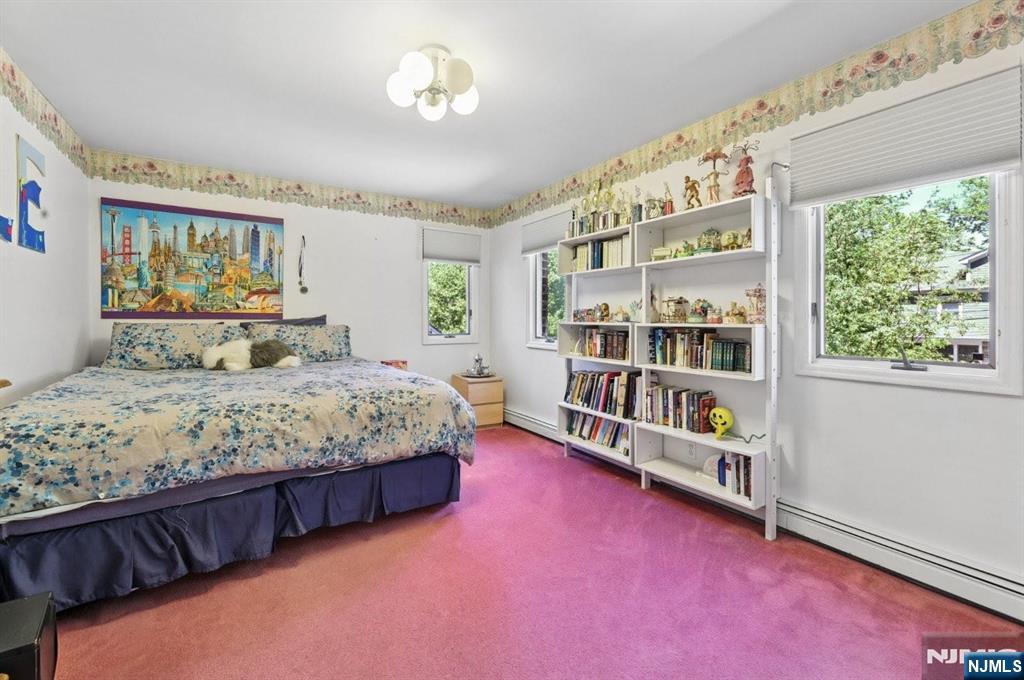 604 Rutland Avenue Teaneck, NJ 07666 - Photo 20 of 31 a bedroom with a bed furniture and a large window
