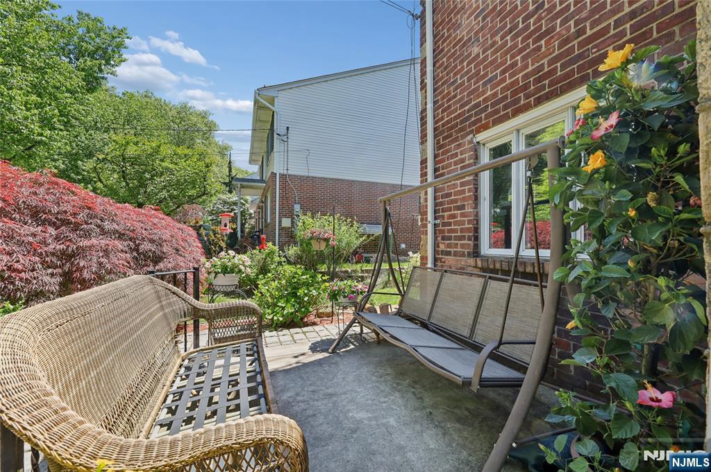 604 Rutland Avenue Teaneck, NJ 07666 - Photo 2 of 31 a view of backyard with outdoor seating and green space