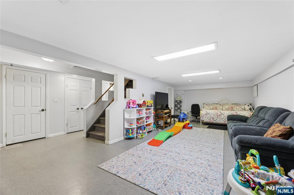 604 Rutland Avenue Teaneck, NJ 07666 - Photo 23 of 31 a living room with furniture and a wooden floor