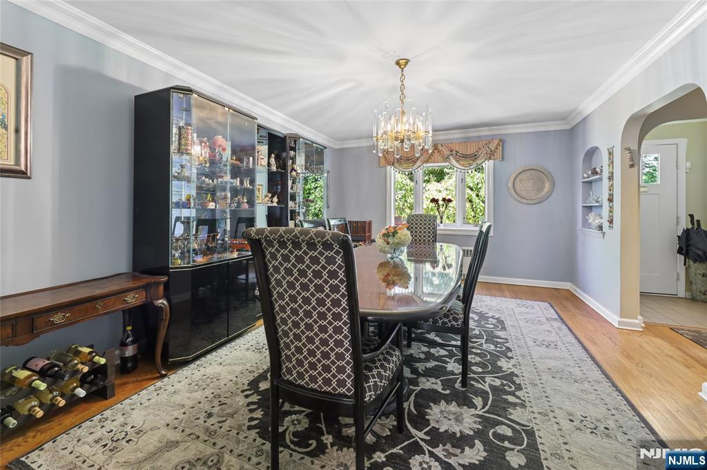 604 Rutland Avenue Teaneck, NJ 07666 - Photo 4 of 31 a view of a dining room with furniture window and wooden floor
