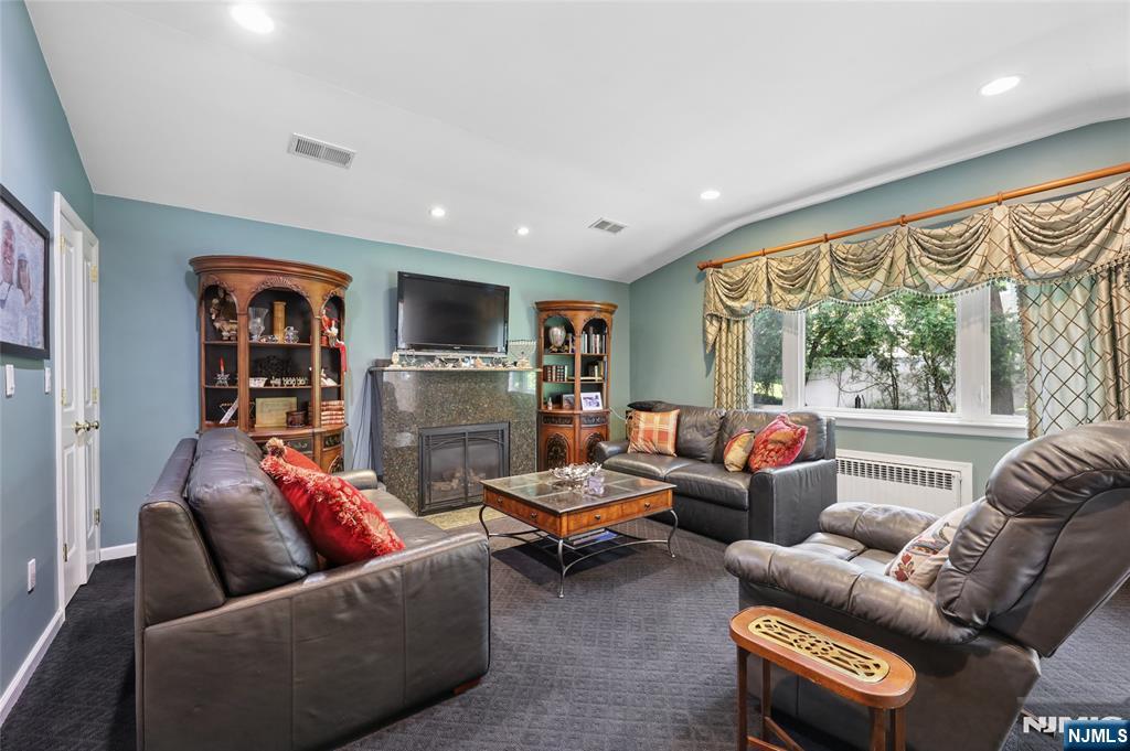 604 Rutland Avenue Teaneck, NJ 07666 - Photo 7 of 31 a living room with furniture and a flat screen tv
