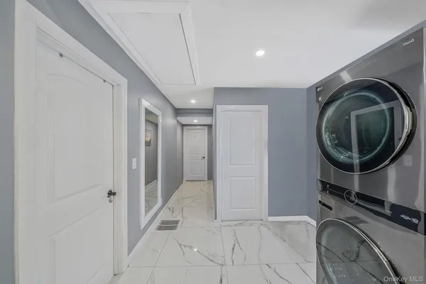a view of a hallway with washer and dryer