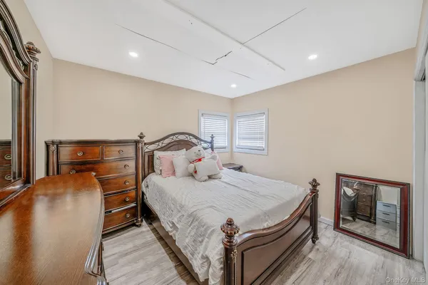 a bedroom with a bed and a tv on table
