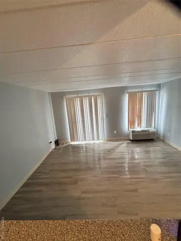 a view of an empty room and window